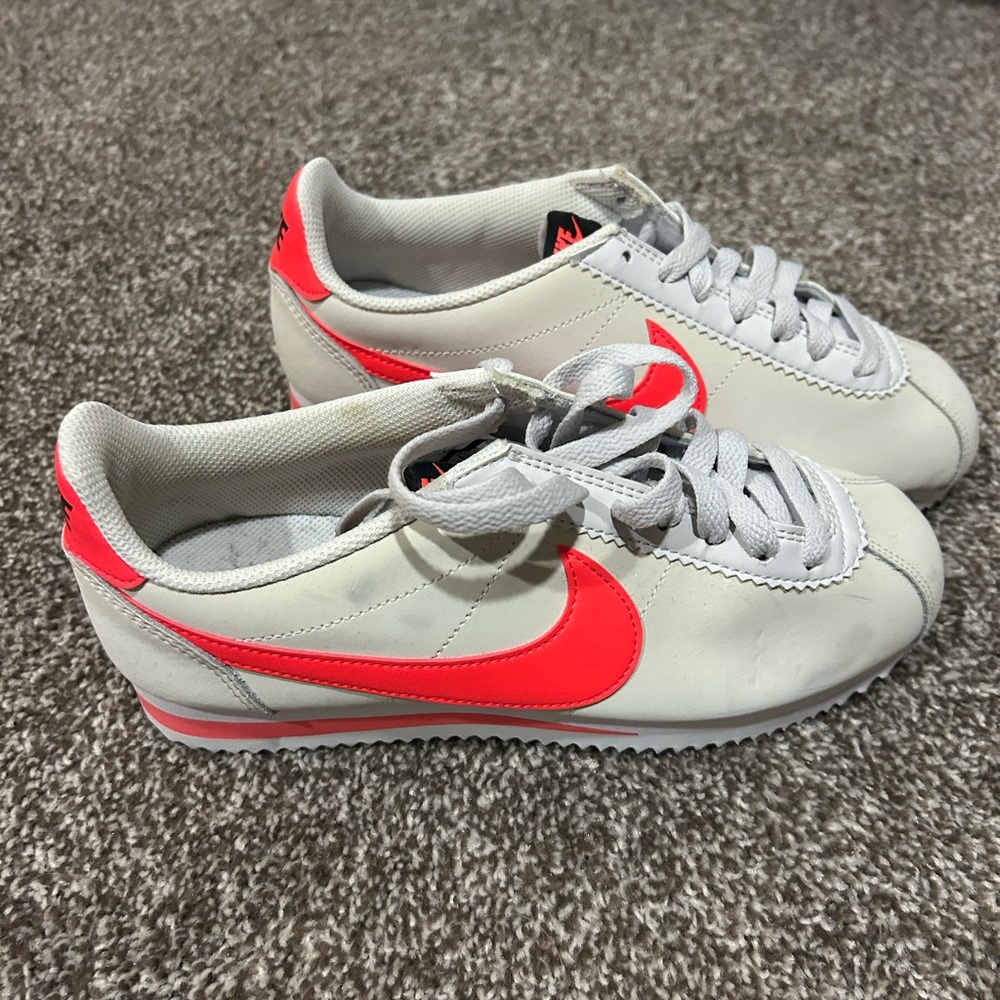 Nike White and Bright Red Cortez Sneakers.